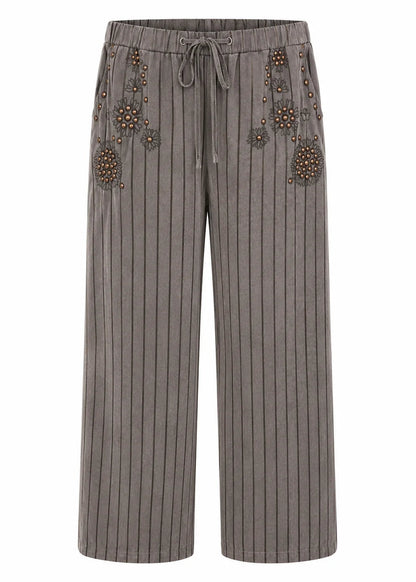 Pantalón wide leg rayas y tachuelas
