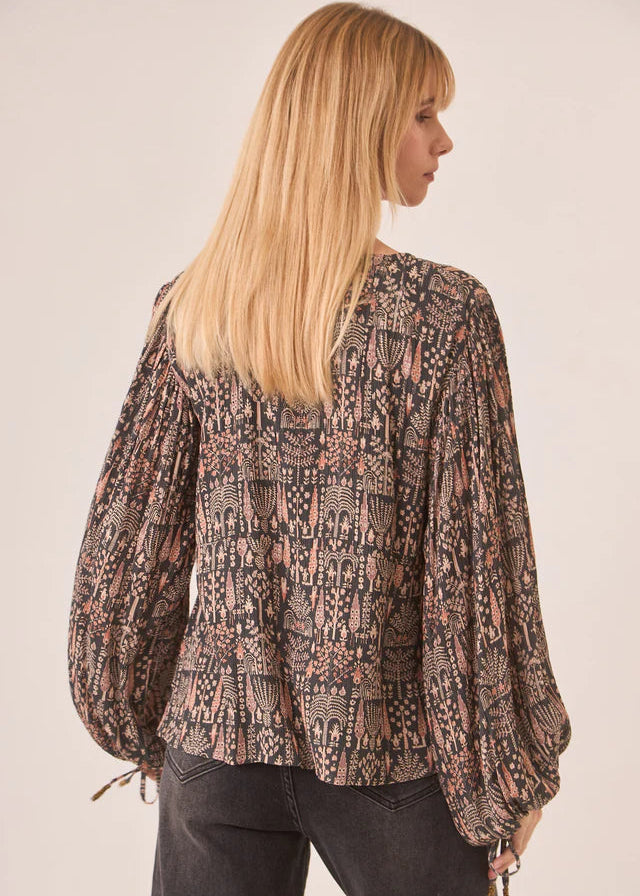 Blusa estampada con mangas abullonadas