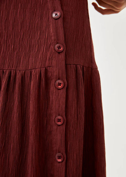 Falda volantes y botones