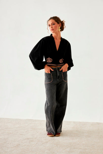 Jeans bolsillos bordados